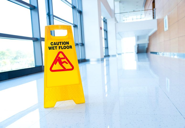 Slippery When Wet Sign Warning Floor - Premises Liability Attorney in California - Johnson Attorneys Group