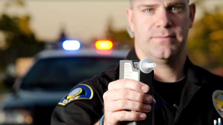 Officer with breathalyzer